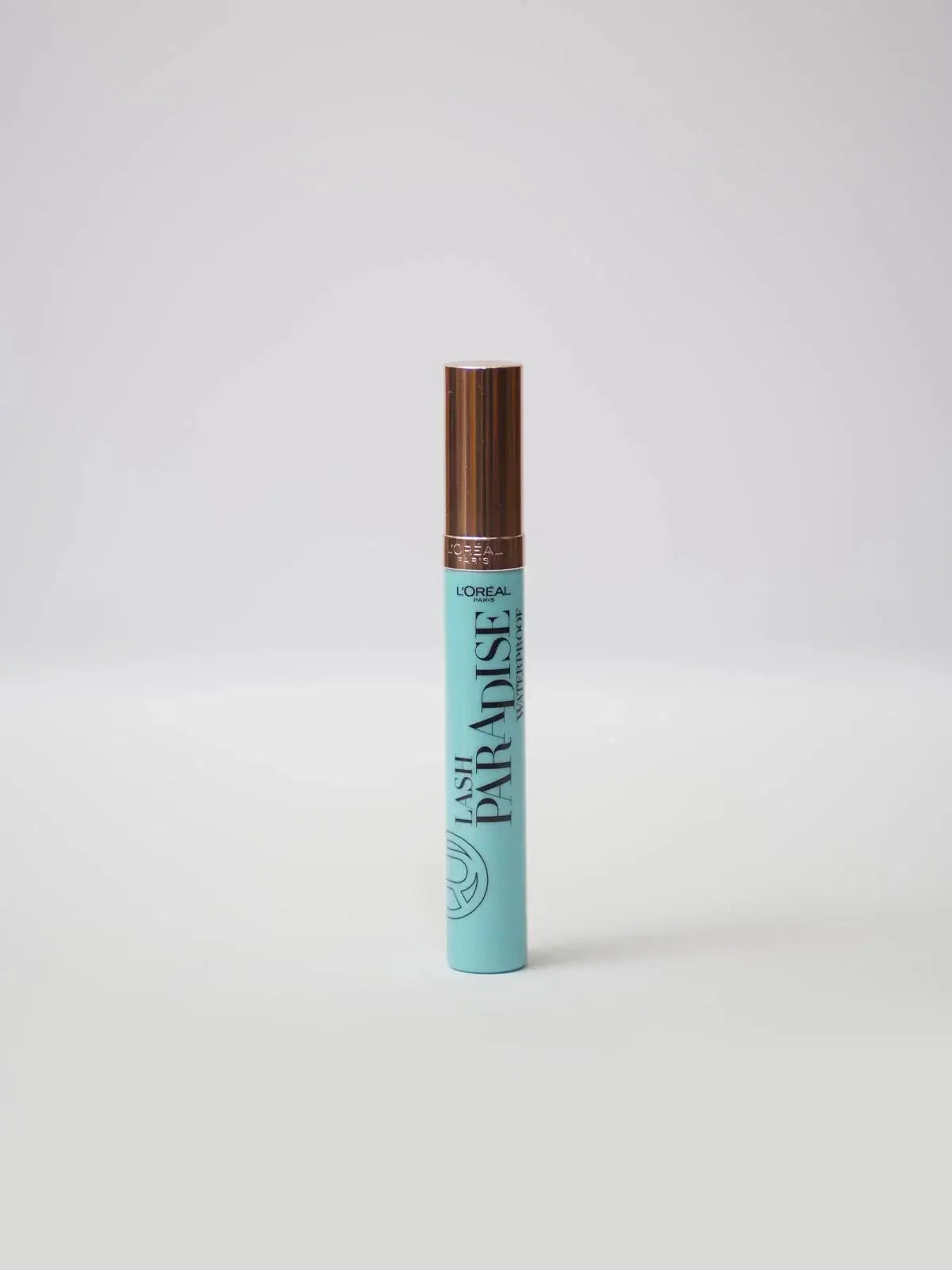L'Oréal Paris Lash Paradise Waterproof mascara in mint tube with rose gold cap, premium makeup essential