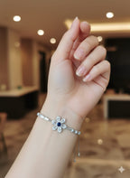 Dainty Silver Floral Bracelet – Blue Sapphire Centerpiece with Baguette Crystals