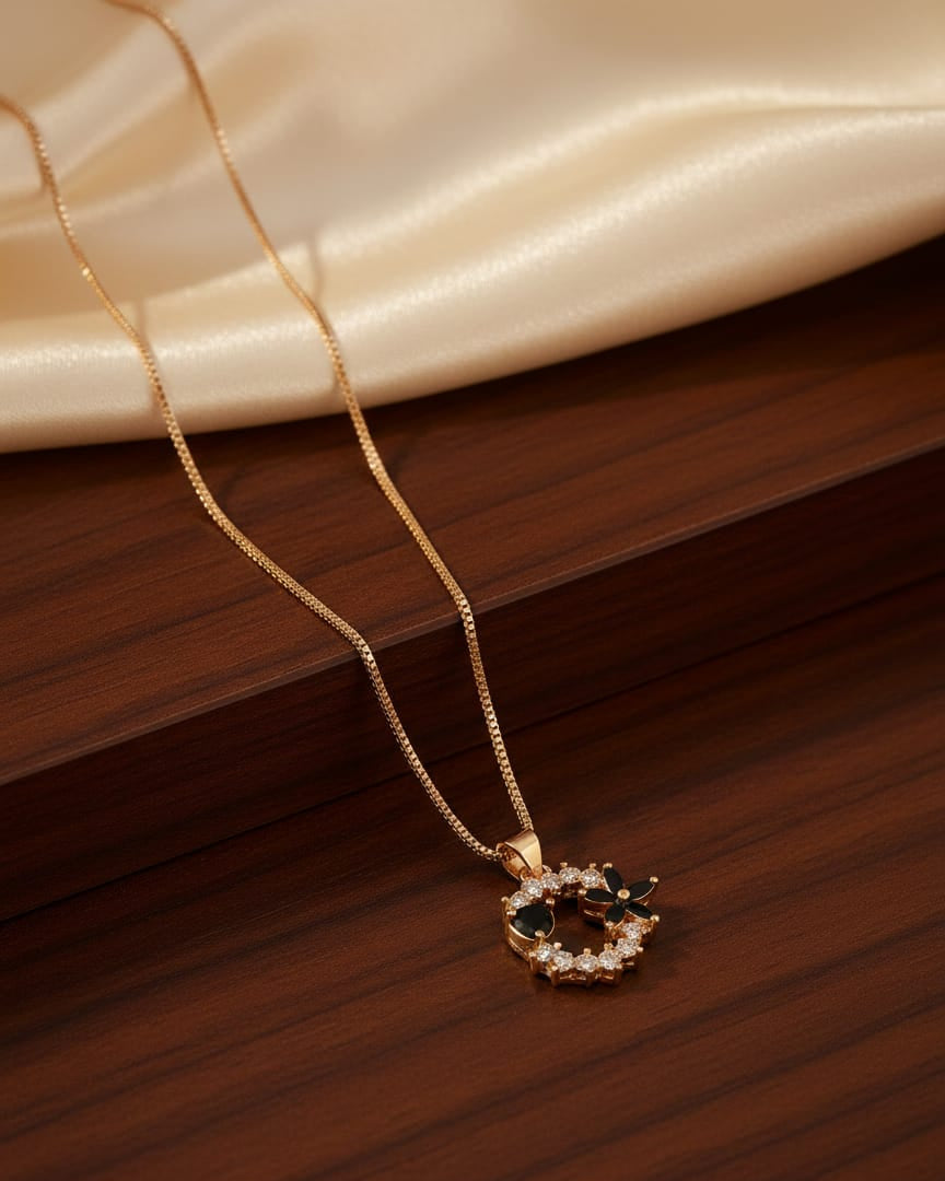 Gold-Tone Floral Wreath Pendant with Black Onyx Accents