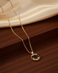 Gold-Tone Floral Wreath Pendant with Black Onyx Accents LAB BEAUTY