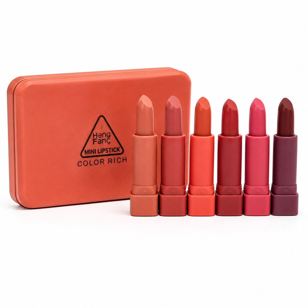 Set of mini lipsticks in various shades with an orange case on a white background