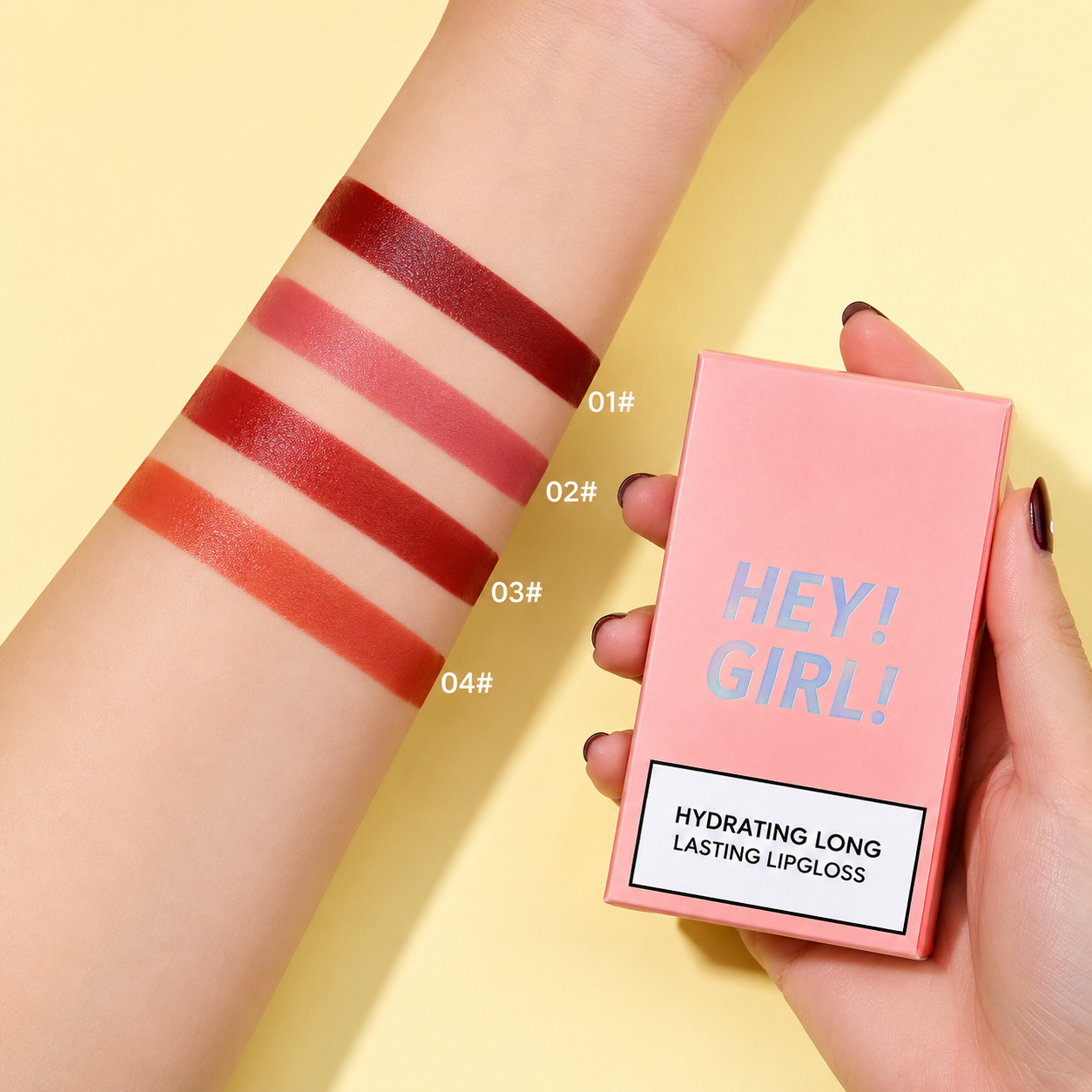 Lip gloss swatches on arm with 'HEY! GIRL!' lip gloss box